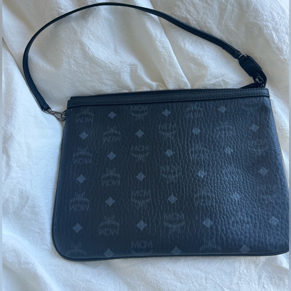 mcm monogram clutch shoulder bag in black